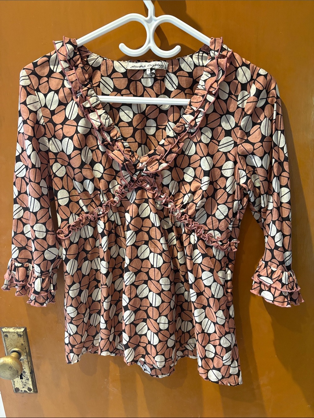 Ruffled V-Neck Long-Sleeve Women's Top in Rust and White Geometric Print